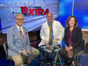 Traditions of Deerfield Executive Director with a FOX19 news anchor and Dr. Robert Keyes