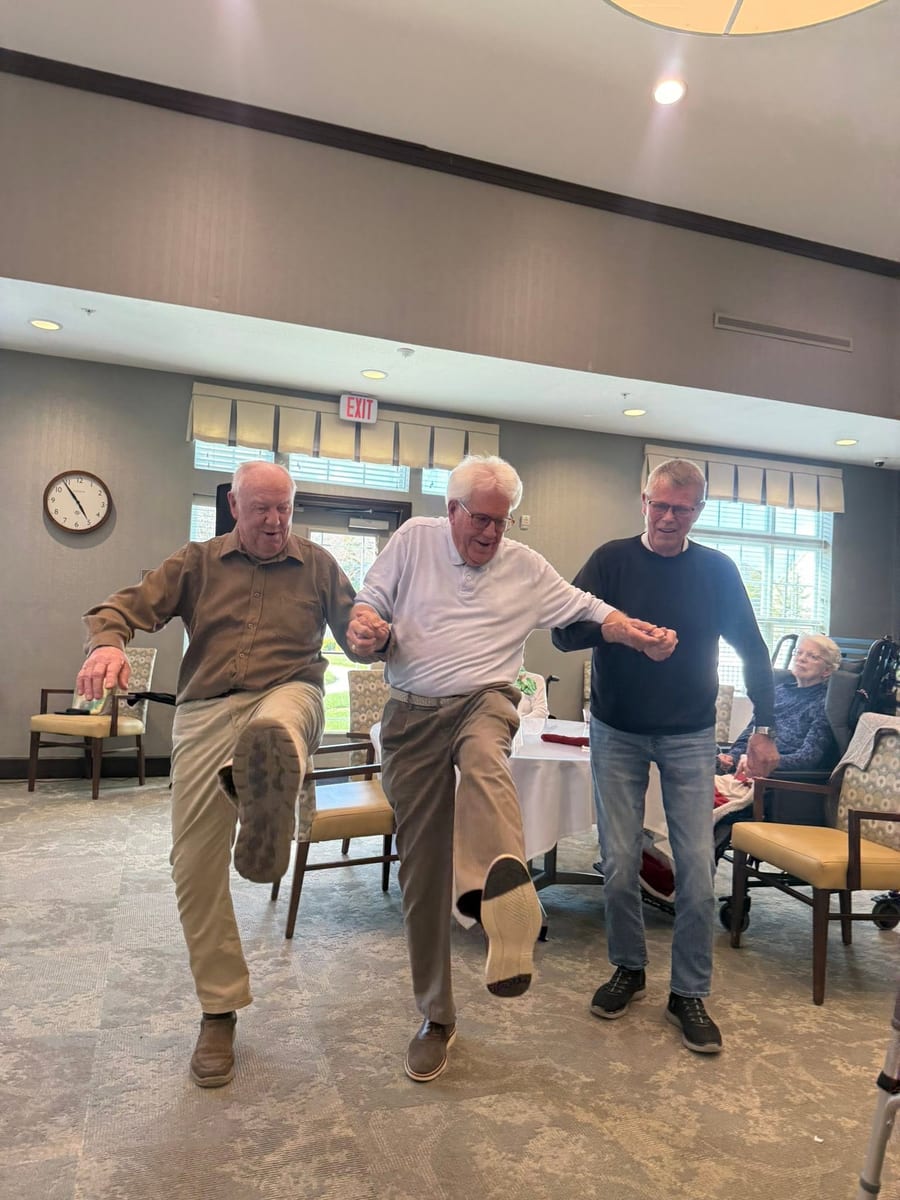 Residents enjoying a fun group dance activity at Traditions of Deerfield